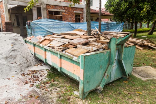 Construction site with builders removing waste in Crystal Palace